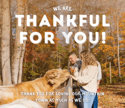 People enjoying autumn with an cow.
