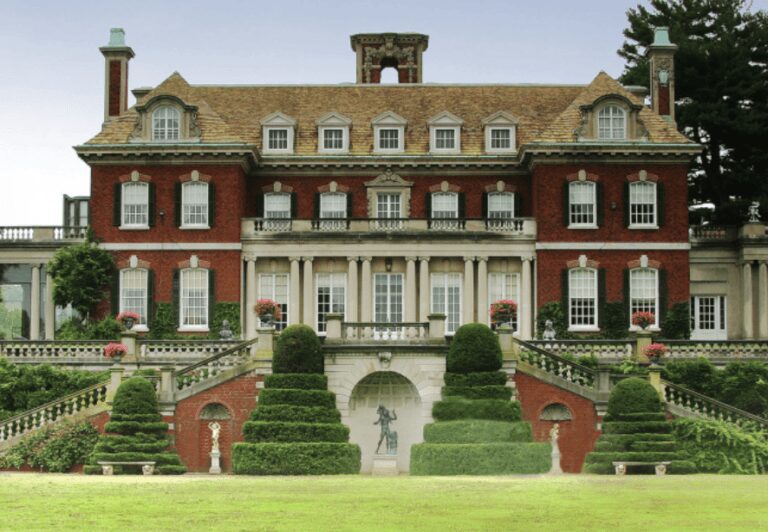 Historic red-brick mansion with manicured gardens.