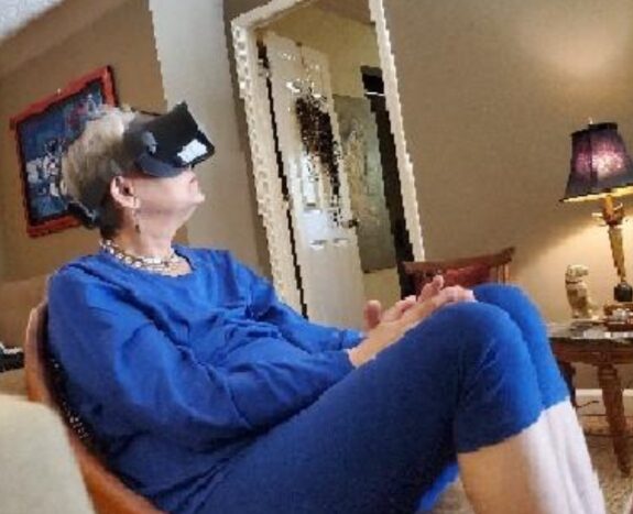 Person wearing VR headset in living room.