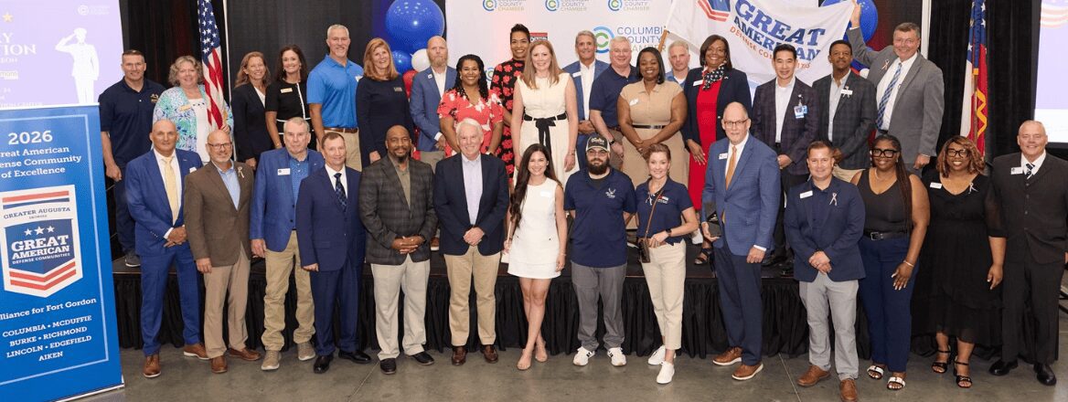 Large diverse group posing at community event